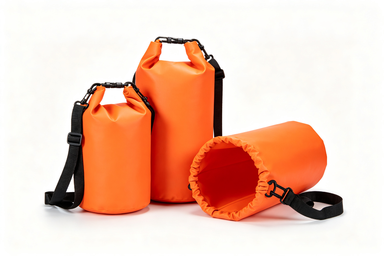 Finished waterproof dry bags in Navy Blue, Olive Green, and Orange colors in 5L, 10L, and 20L sizes, showing roll-top closure, shoulder strap, D-ring, and bottom handle