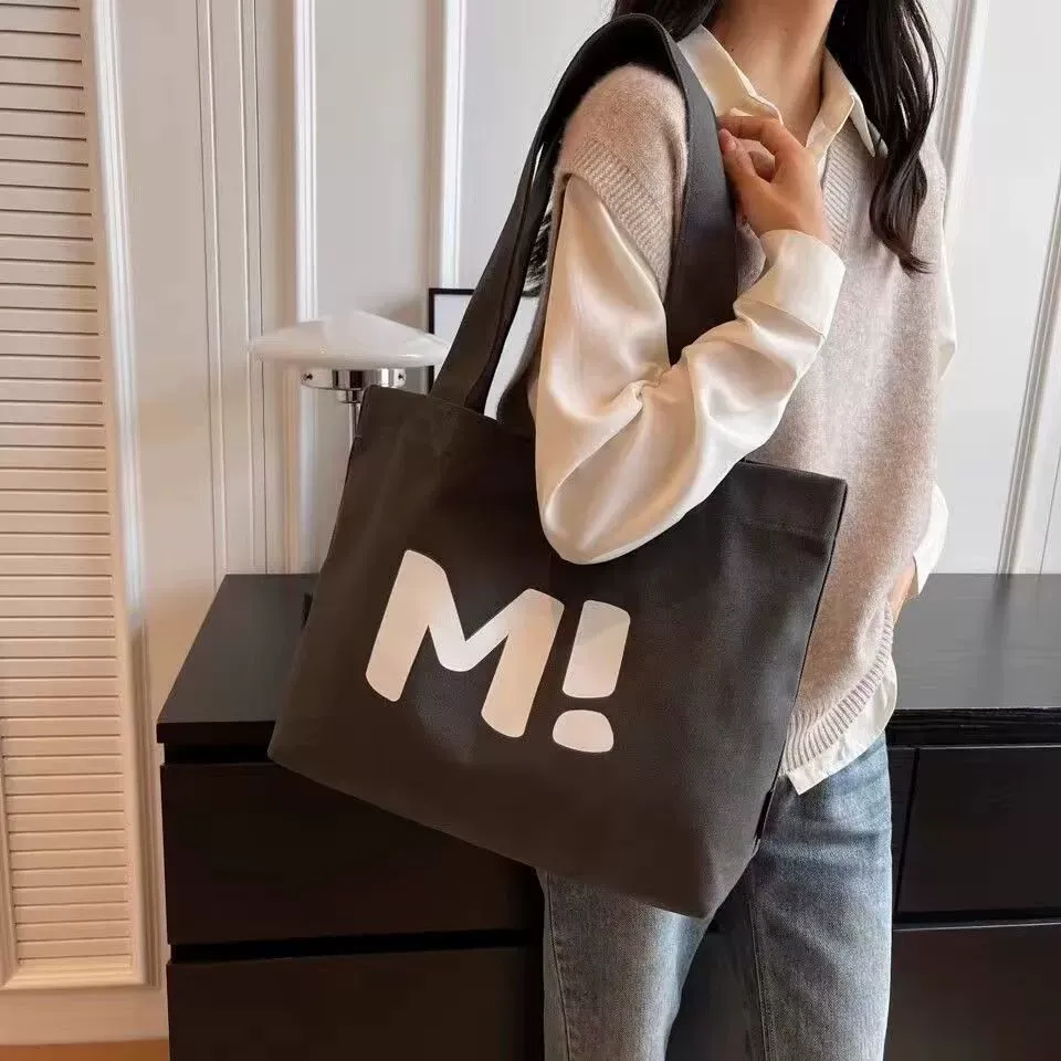 Grey and khaki color options of heavy canvas shopping tote
