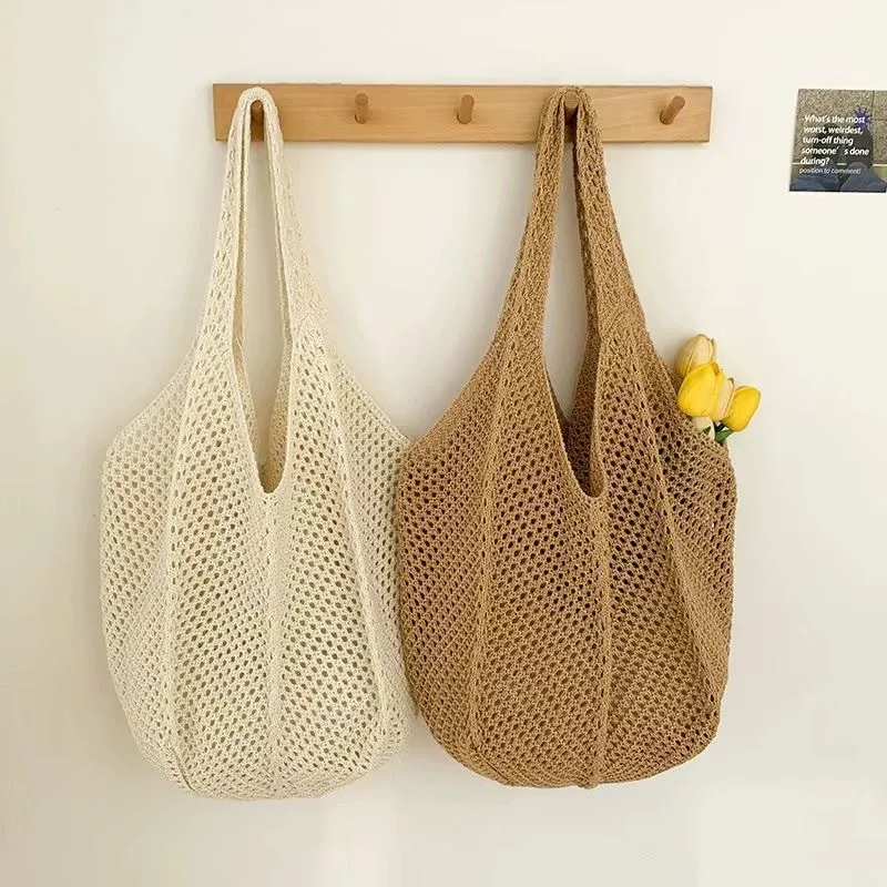 22 color options of crocheted mesh tote bags laid out