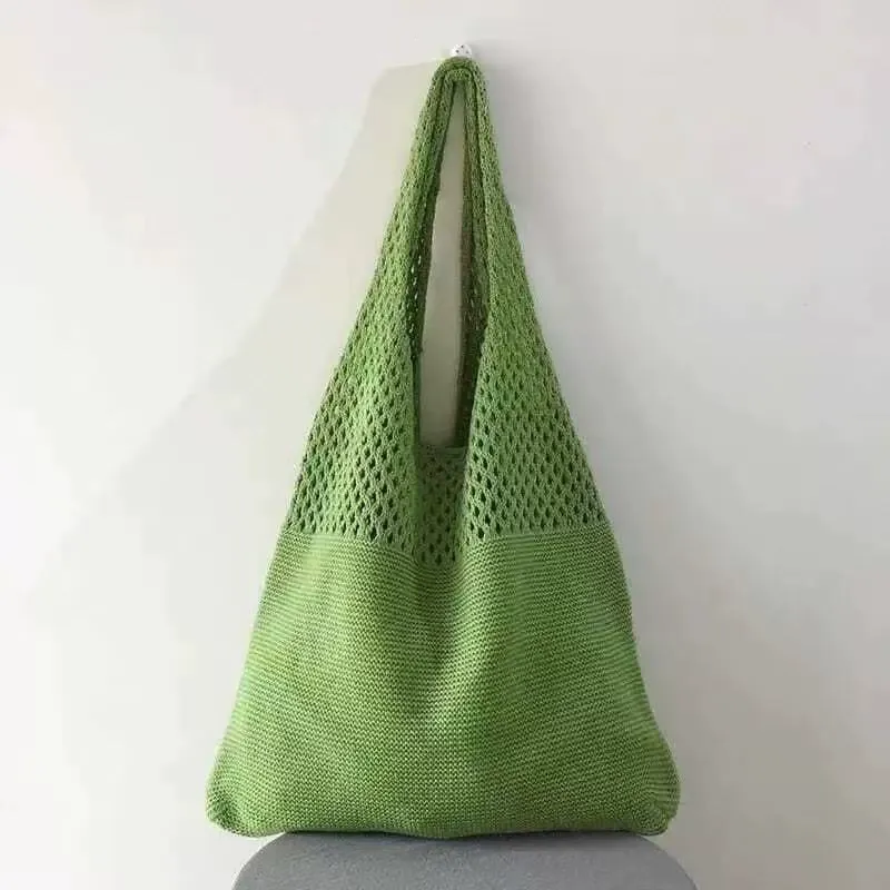 Wooden bead handle detail and strap weaving on crocheted bag