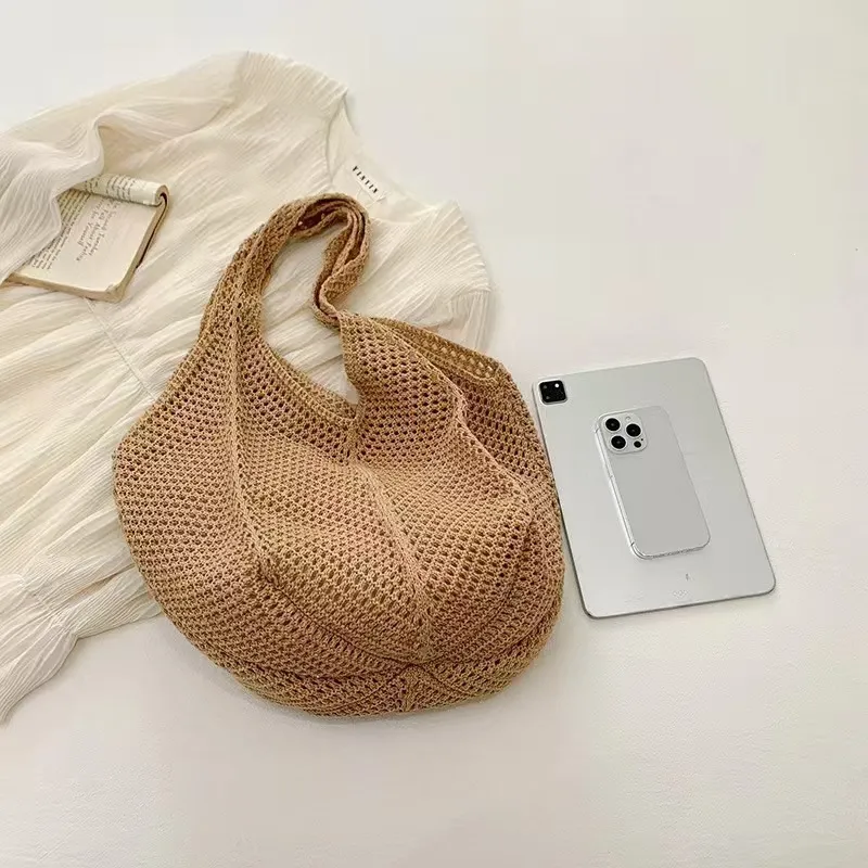 Hand-crocheted mesh tote bag in sage green with wooden bead handles