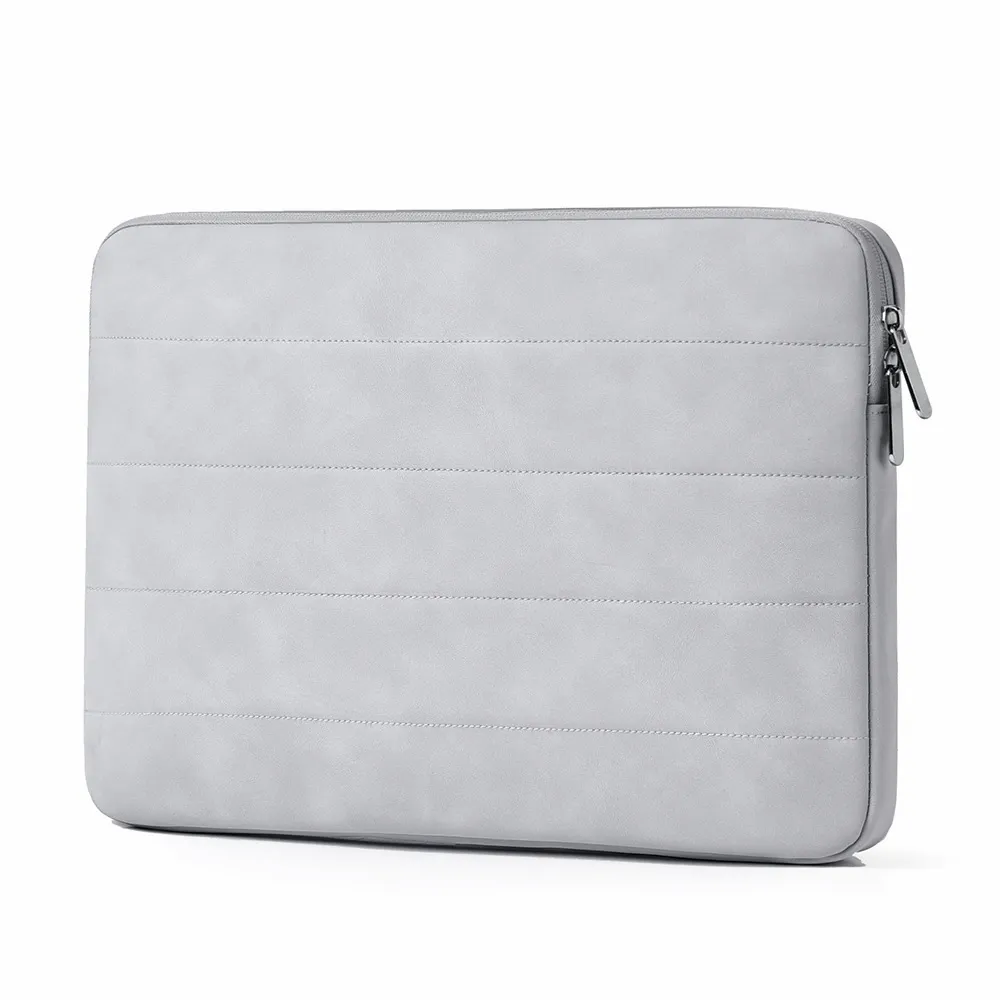 Light grey quilted laptop sleeve showing shockproof padding texture