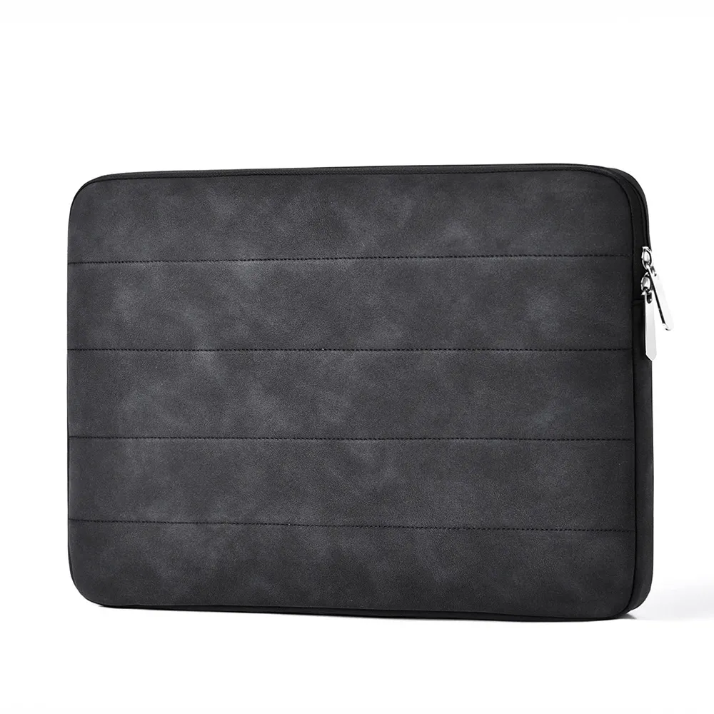 Dark quilted laptop sleeve showing PU material and zipper