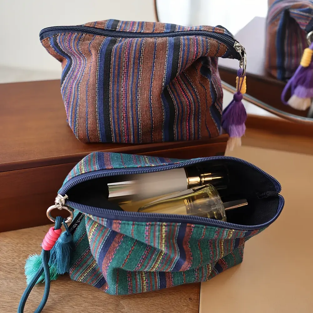 Woven stripe fabric and knotted fringe detail of the pouch