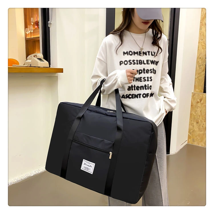 Dual-color duffel bag display in indoor setting