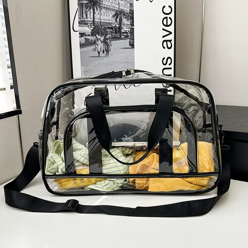 Clear PVC duffel packed with travel items, visible transparent material
