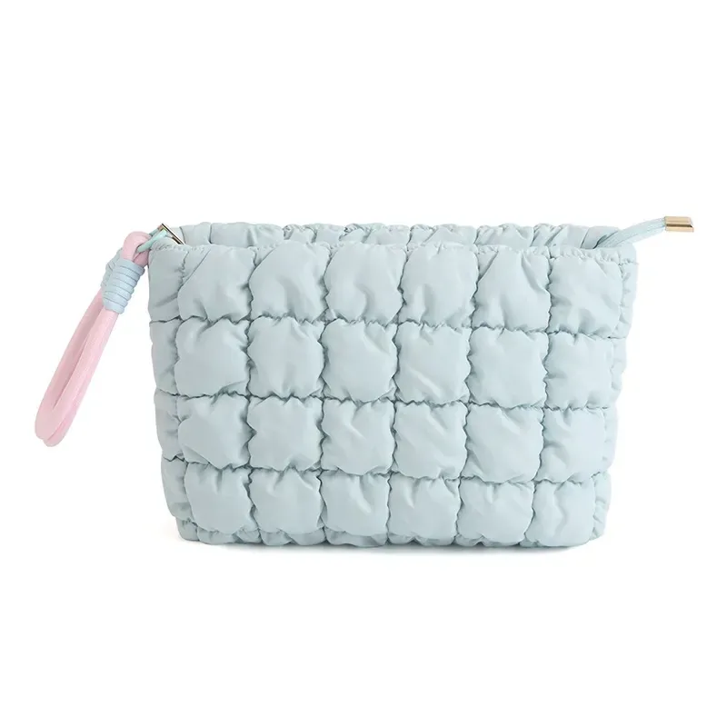 Quilted puffer makeup pouch in neutral beige colorway