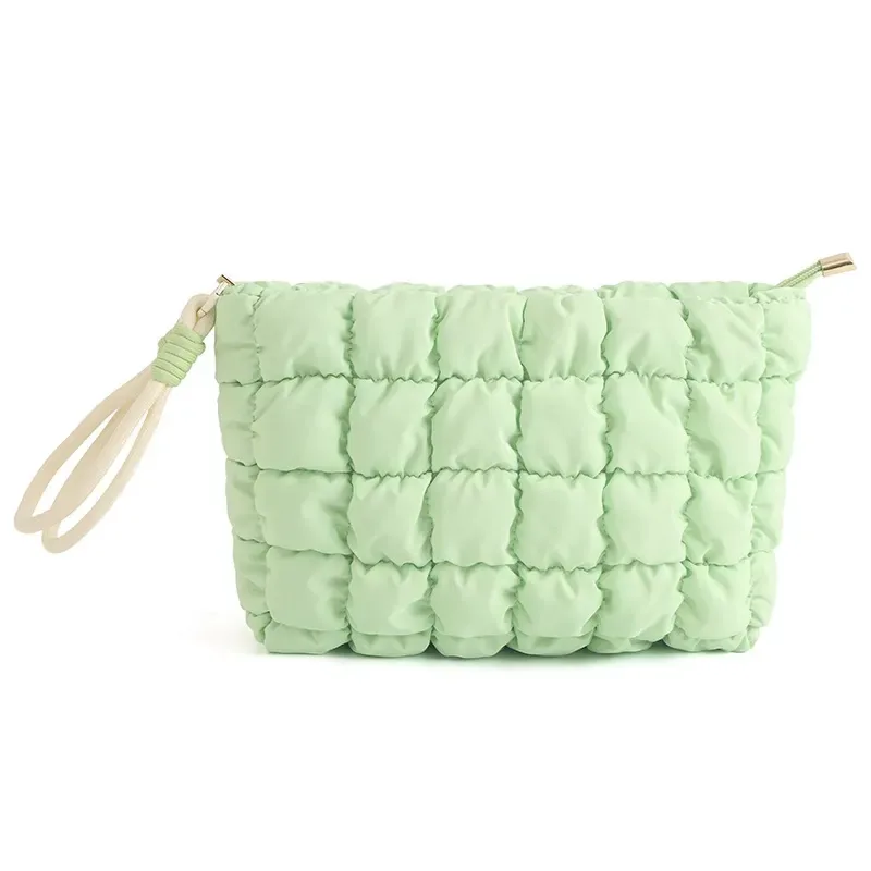 Cloud-puffer cosmetic bag styled as a hand-carried beauty pouch