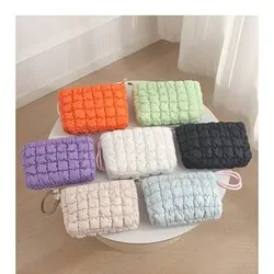 Soft padded polyester shell of the cloud-puffer cosmetic pouch