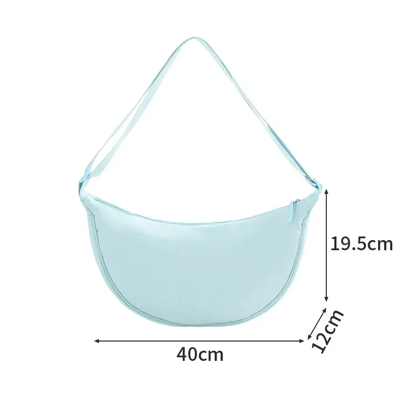 Crescent nylon bag styled as a daily crossbody carry