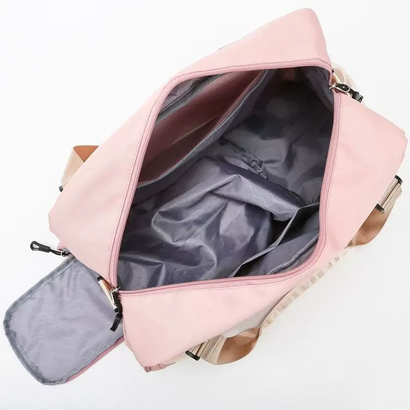 Open gym duffel showing interior dry-wet separation compartments