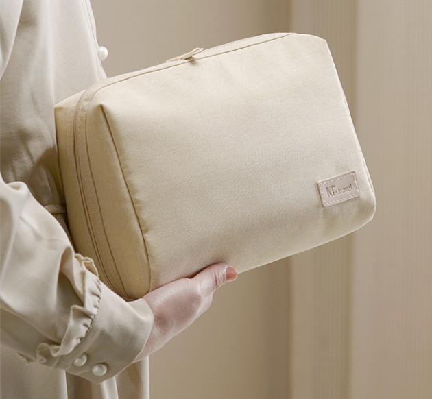 Neutral beige travel pouch in sustainable RPET fabric