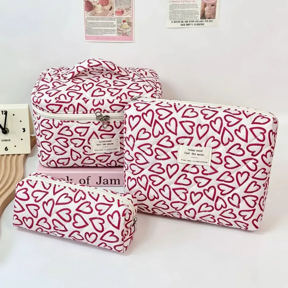 Quilted patchwork cosmetic pouch with fabric tag and zip