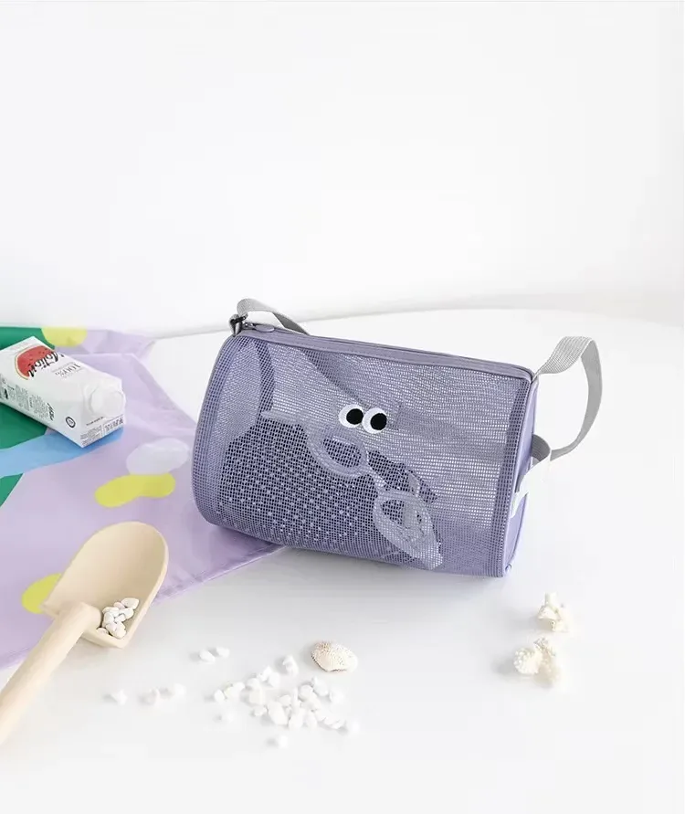 Mesh cylinder duffel packed with towel, sandals and toiletries