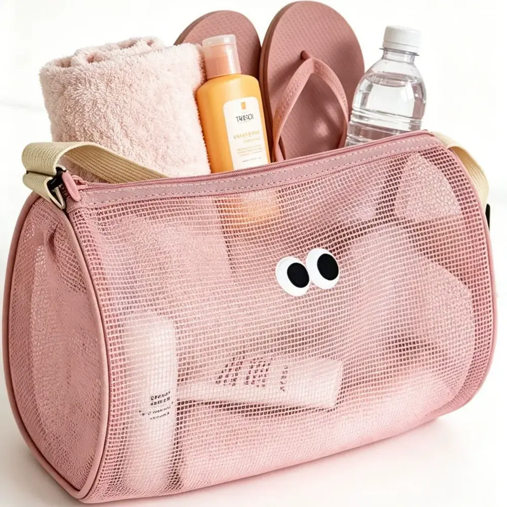 Pink mesh cylinder swim gym duffel with drawcord top and cartoon eye patch