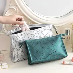 Quilted cosmetic bag in silver-white and deep green colorways