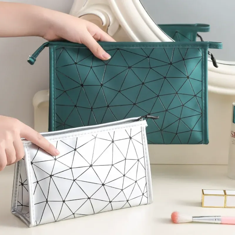 Quilted PU cosmetic pouch showing diamond stitching and zip top