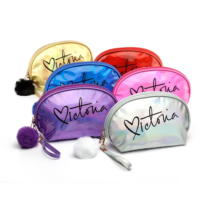 Six laser half-moon cosmetic bags in holographic colors with pom-pom charms