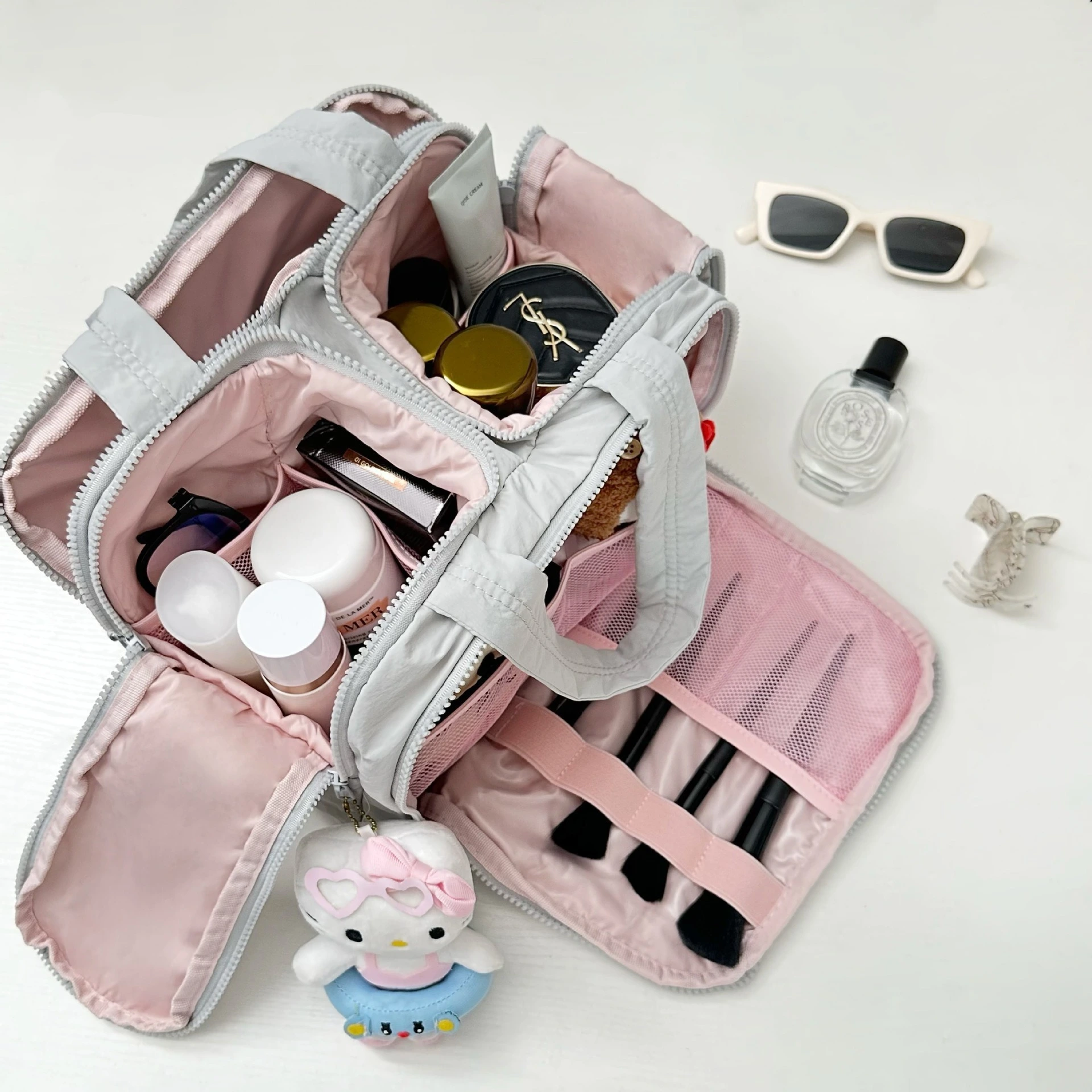 Duffel bag with hidden trolley sleeve attached to rolling suitcase handle