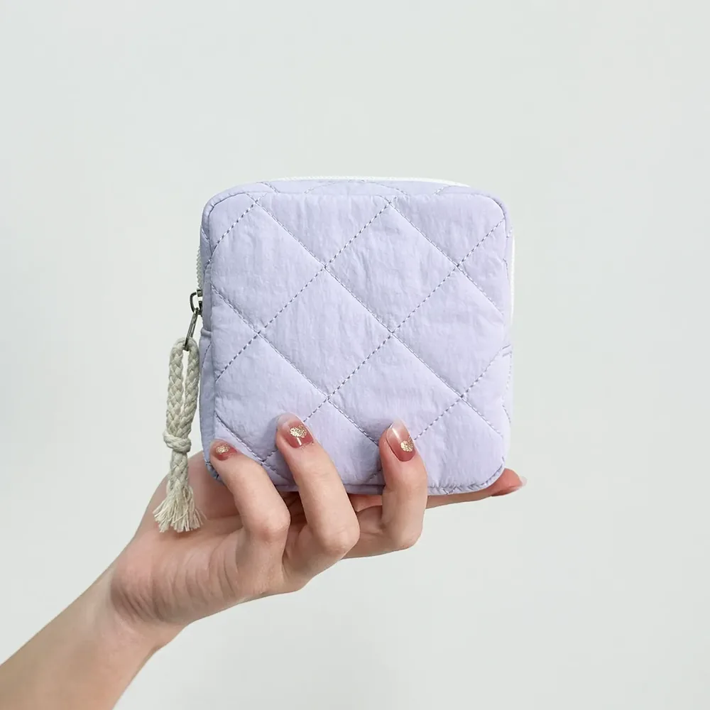 Quilted polyester with embroidered bow detail