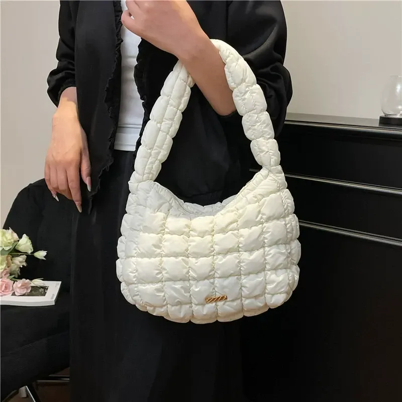 Quilted cloud bag styled as a shoulder carry accessory
