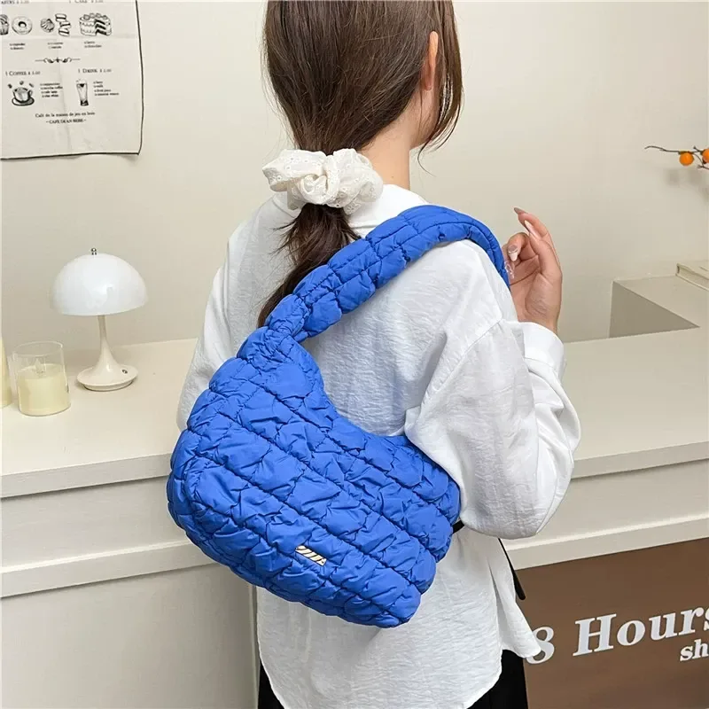 Crescent-shaped quilted underarm bag with zipper