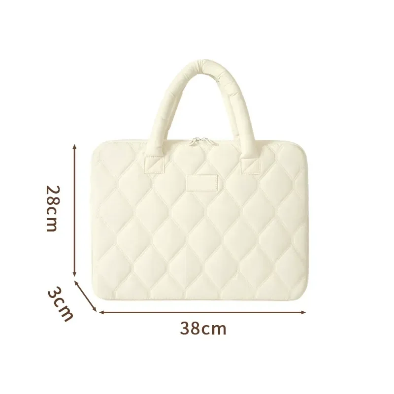Quilted commuter laptop sleeve styled on a bright desk