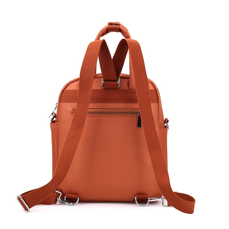 Rear view of quilted nylon convertible backpack showing adjustable shoulder straps and back panel