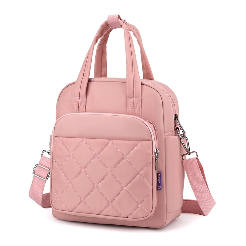 Pink color variant of diamond-quilted nylon convertible backpack with detachable crossbody strap