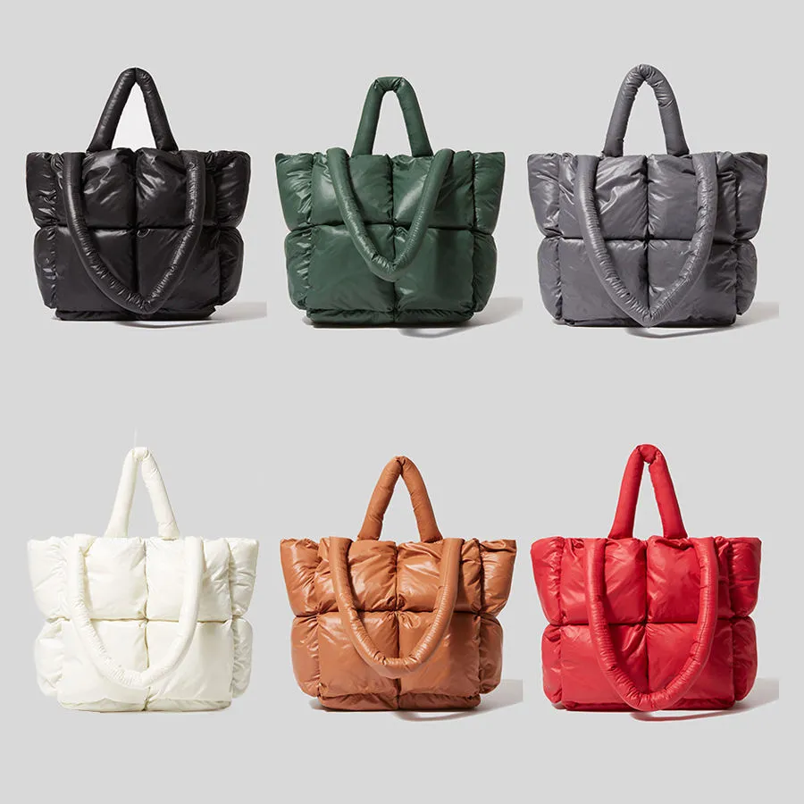 Six colors of quilted puffer tote bags laid out together