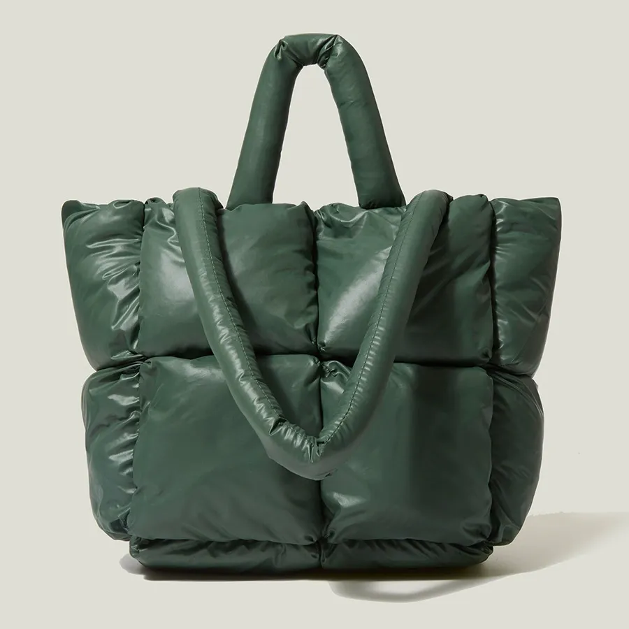 Dark green quilted puffer tote bag with soft nylon texture