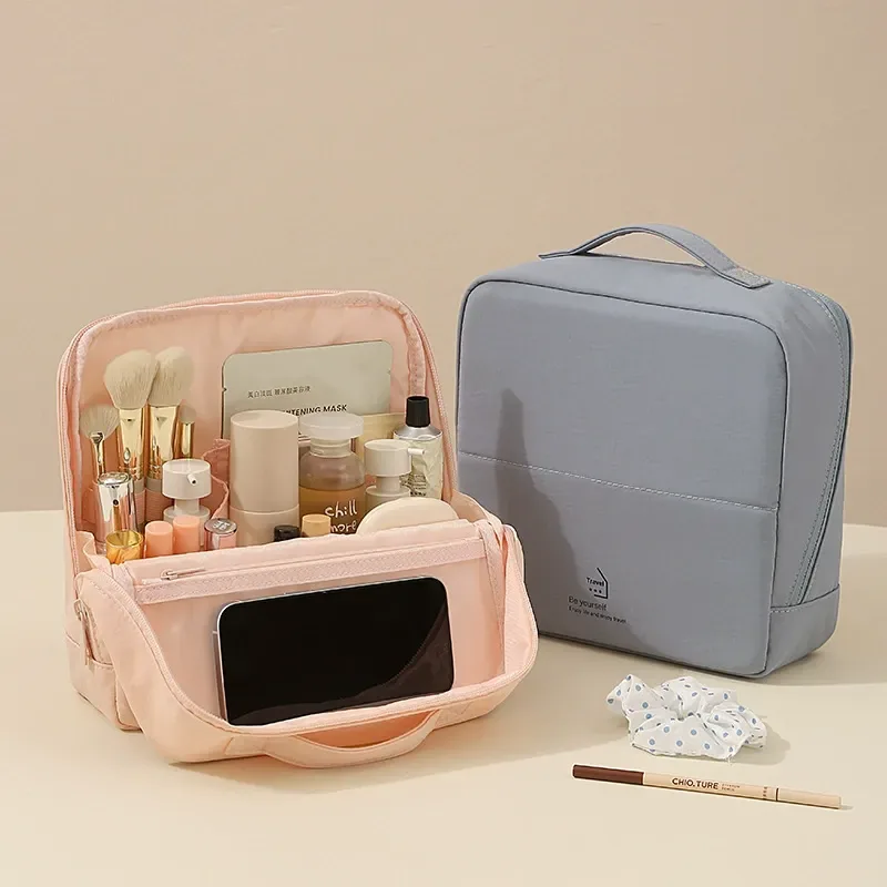Standing makeup brush organizer with mesh divider slots on a vanity