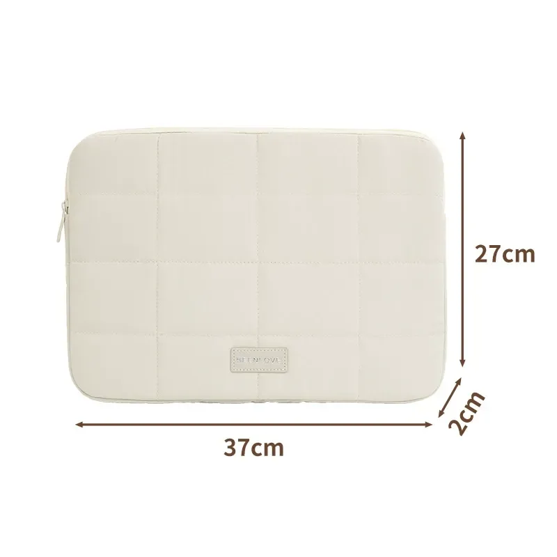 Quilted ultra-light laptop sleeve showing zipper and structure