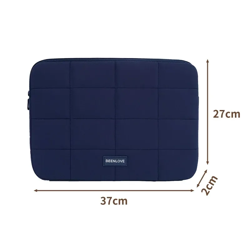 Navy ultra-light quilted laptop sleeve with dimensions marked