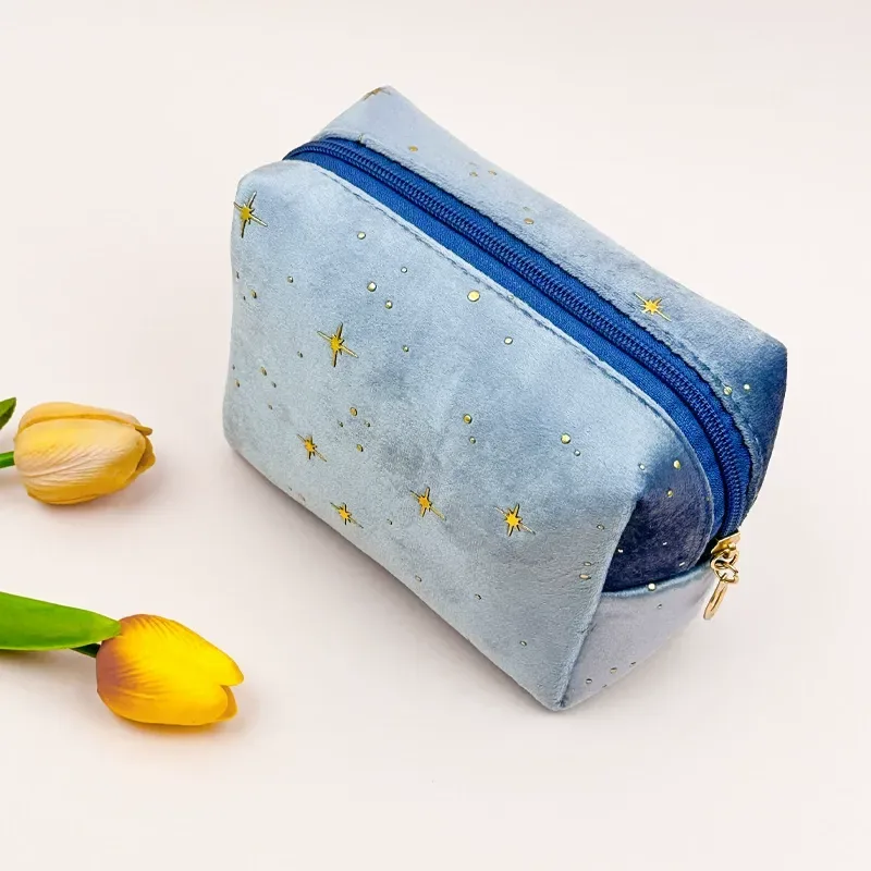 Velvet octagon pouch showing gold star dots and zipper