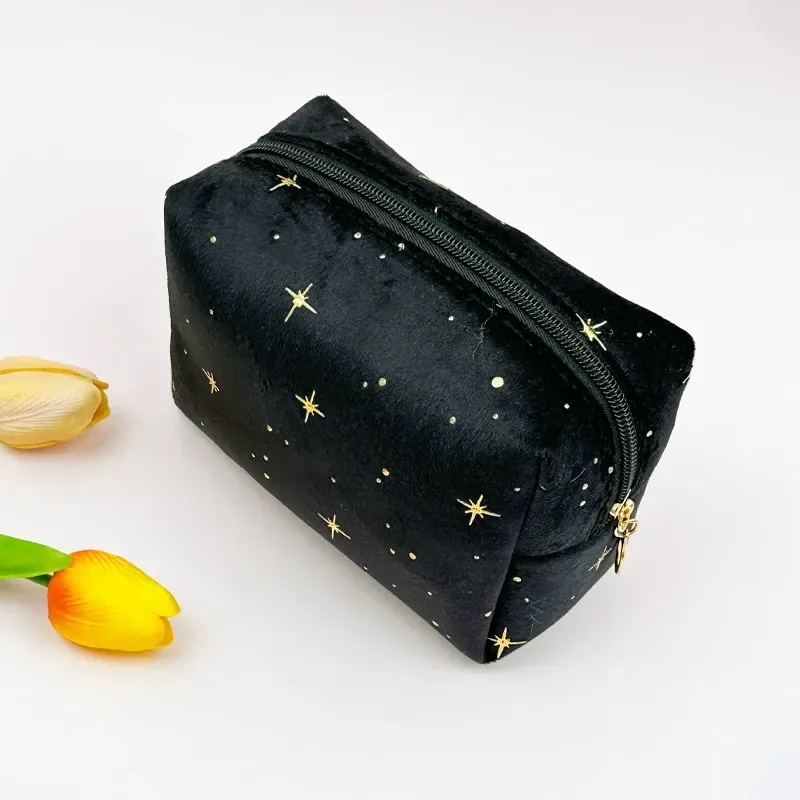 Octagon-shaped velvet makeup bag with gold ring pull