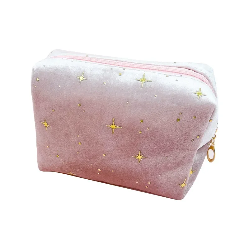 Pink velvet octagon cosmetic bag with gold star print on white background