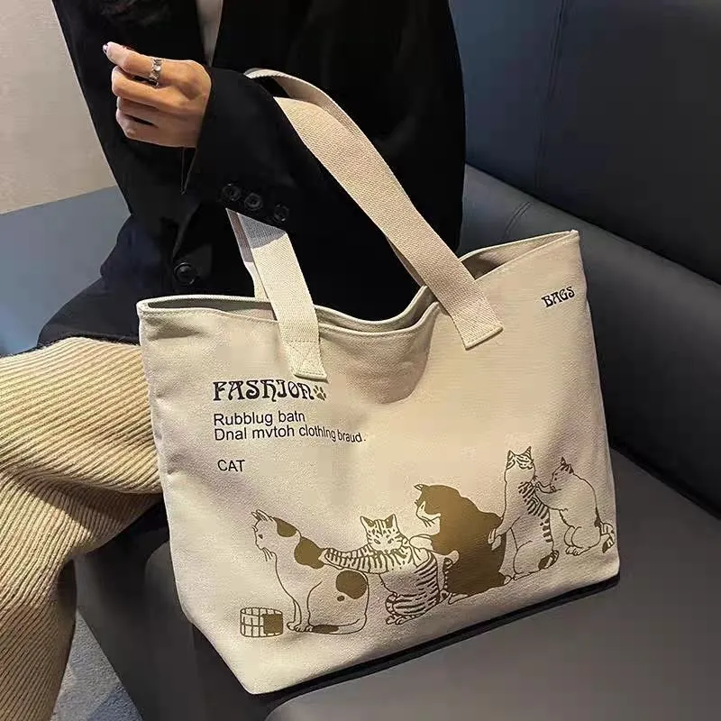 Top zip closure and interior phone pocket detail on Japanese canvas tote