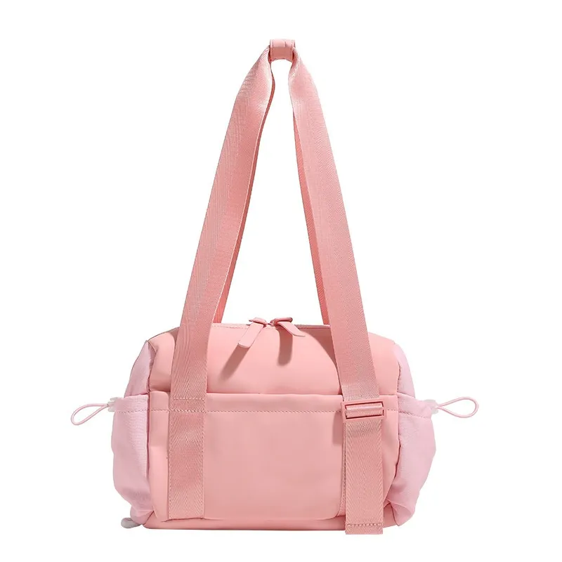 Nylon gym duffel tote being used at the gym with workout gear
