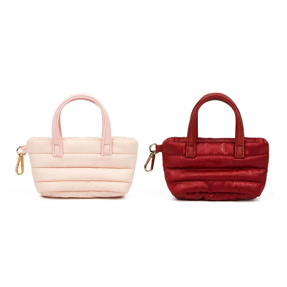 Quilted mini nylon bag color options side by side in blush pink and wine red