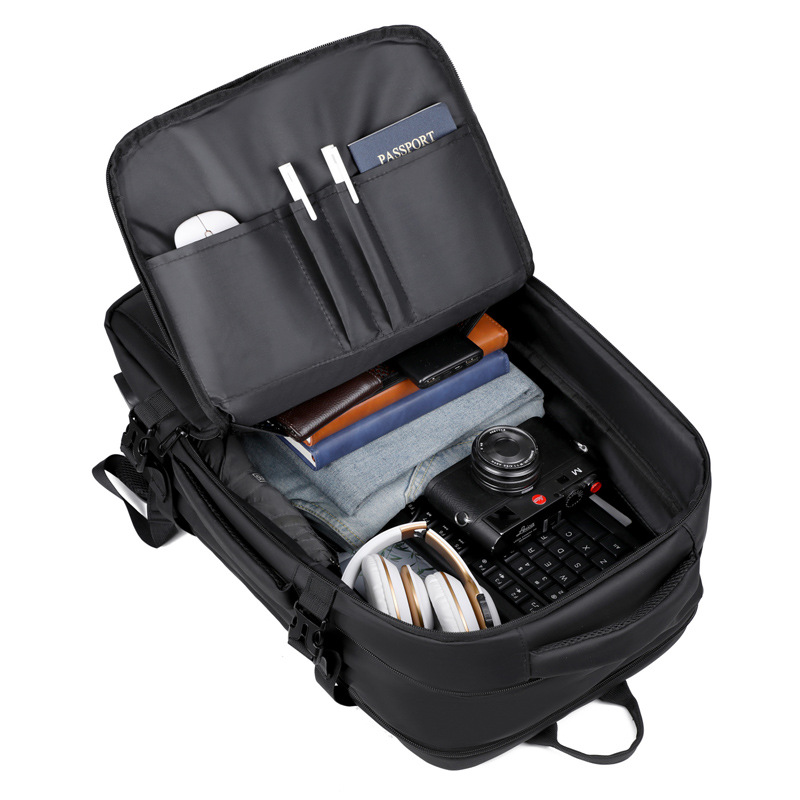 Interior multi-compartment organizer with laptop, accessories, and clothing storage.